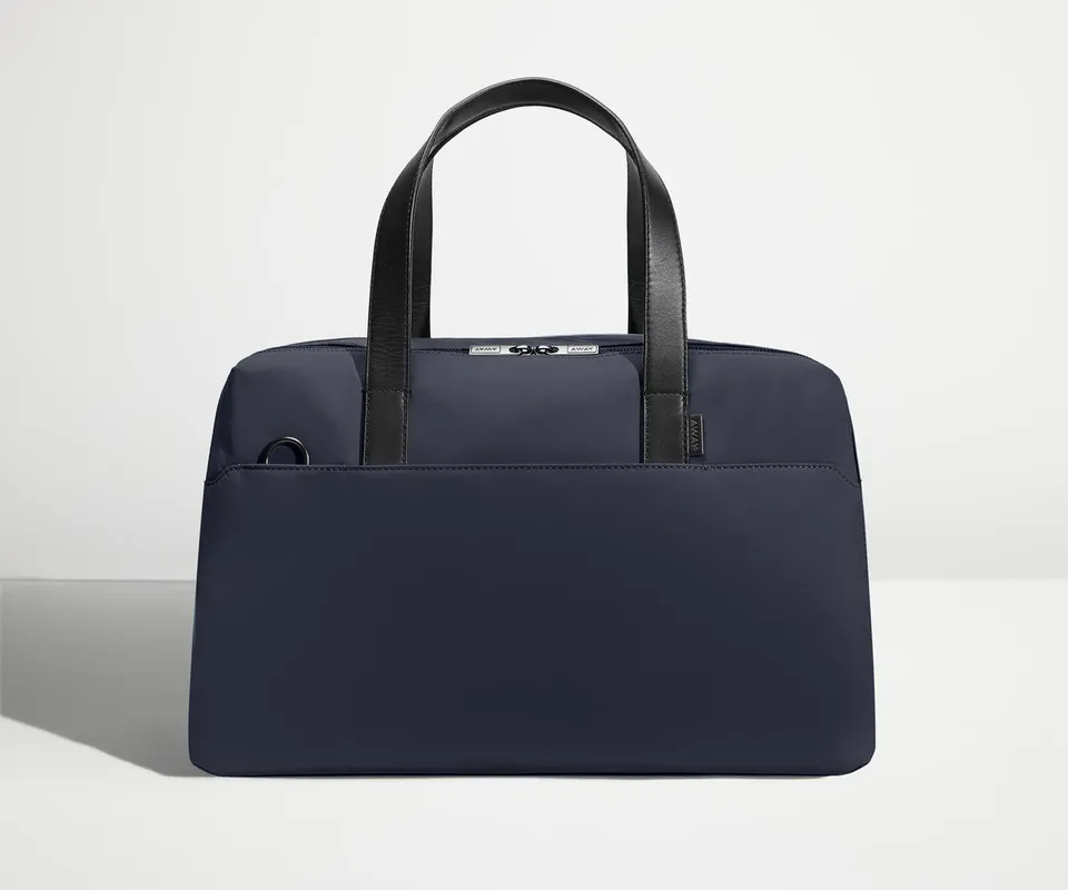 away-the-overnight-bag-in-navy-blue-medium-duffle-with-padded-laptop-sleeve image 1