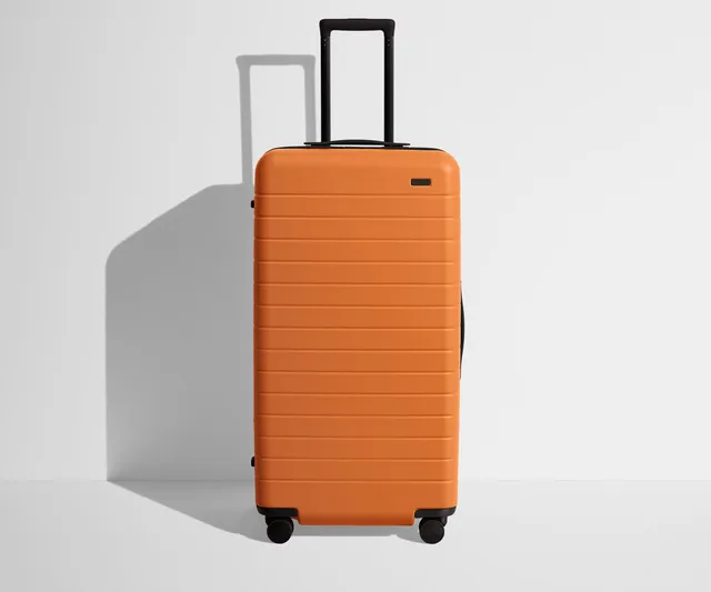 away-the-trunk-in-sorbet-orange-large-checked-suitcase image 1