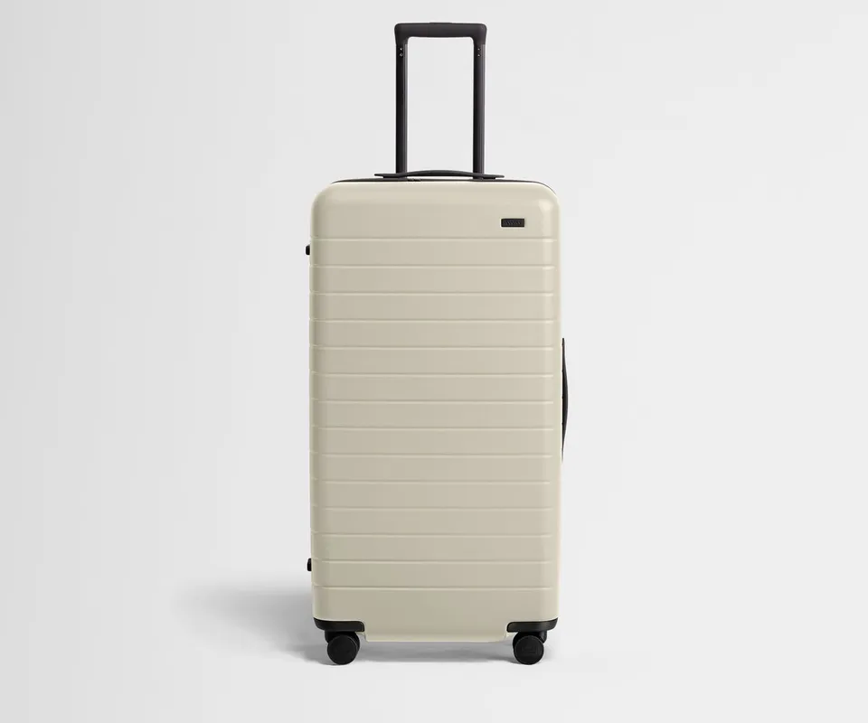 away-the-trunk-in-salt-white-spacious-checked-luggage image 1