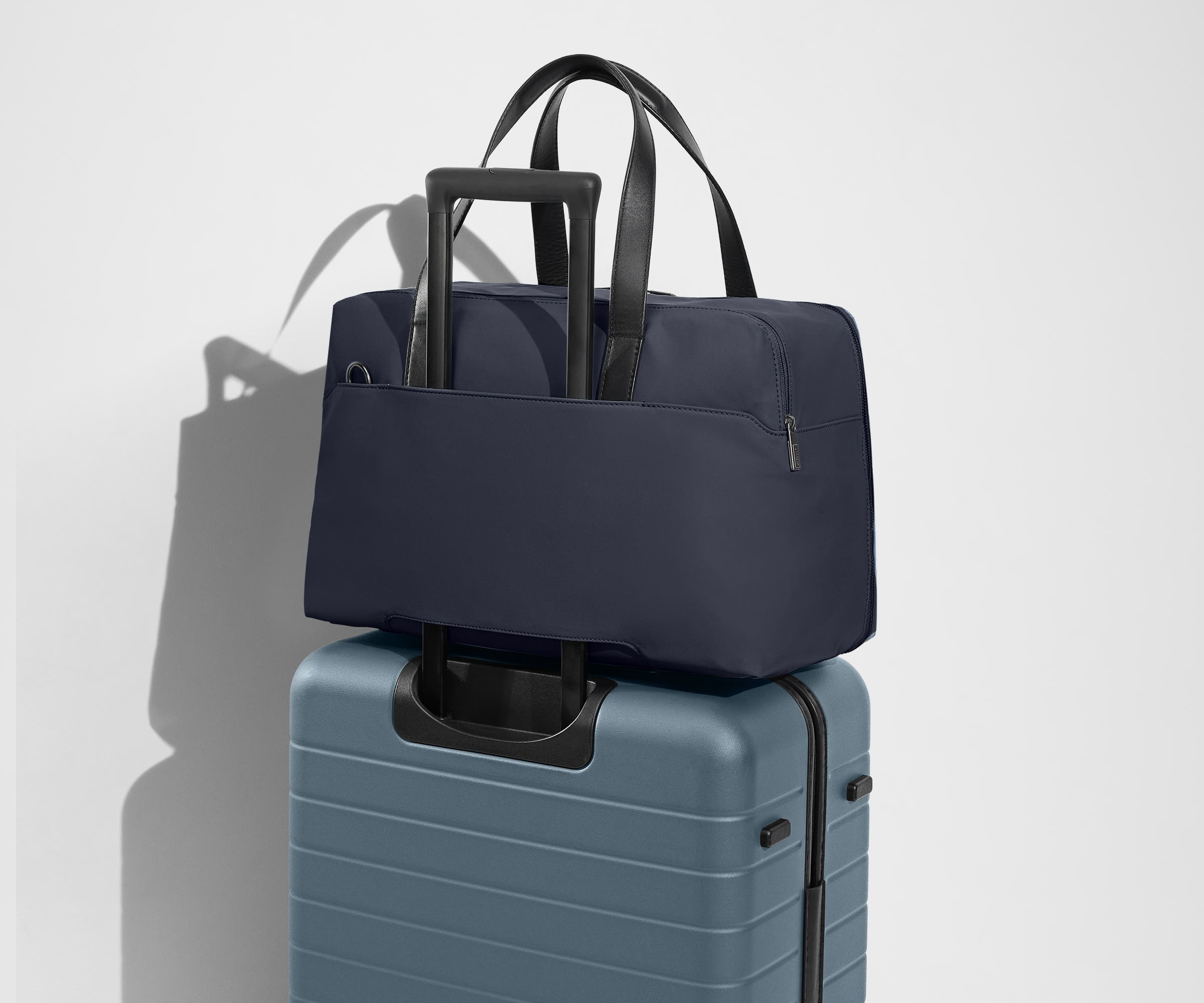 away-the-overnight-bag-in-navy-blue-medium-duffle-with-padded-laptop-sleeve image 8