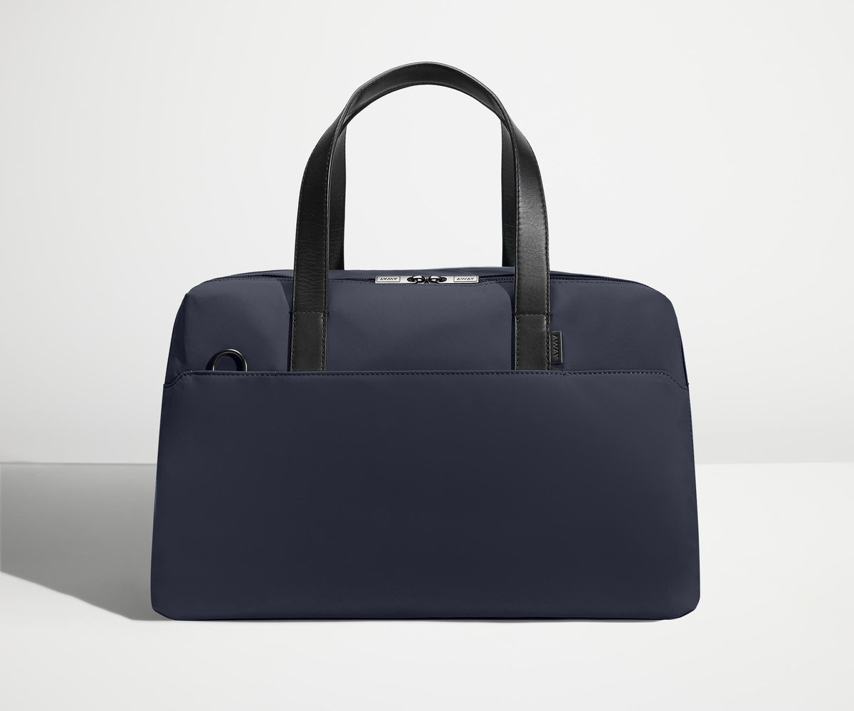 away-the-overnight-bag-in-navy-blue-medium-duffle-with-padded-laptop-sleeve image 1